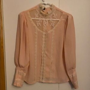 Romantic lace and buttons blouse.